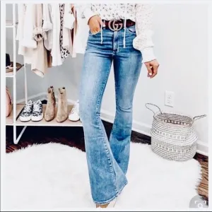 Mid Rise washed denim flared jeans. Size 27. Has some stretch.