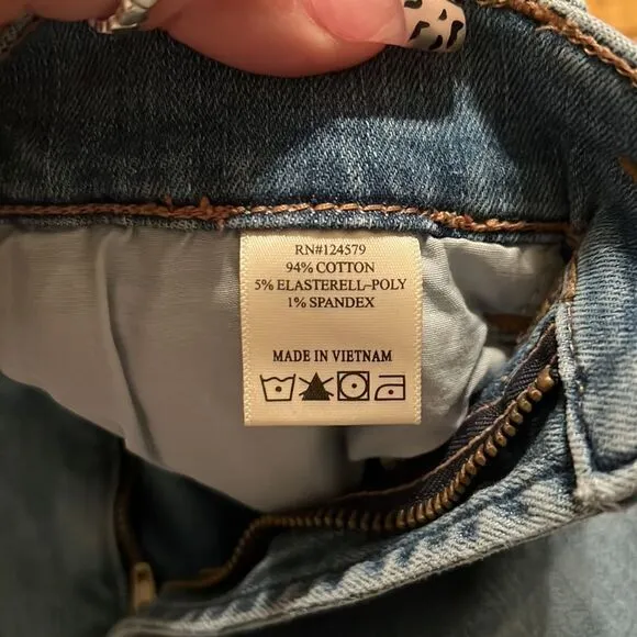 Mid Rise washed denim flared jeans. Size 27. Has some stretch.